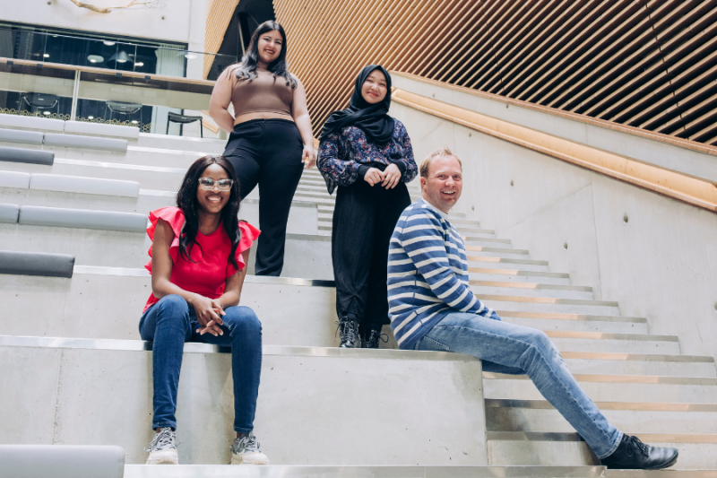 Students posing on the university stairs